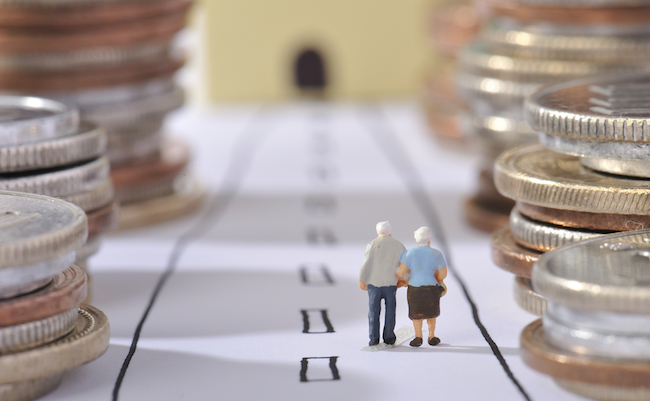 Couple of elderly walking the road surrounded by money