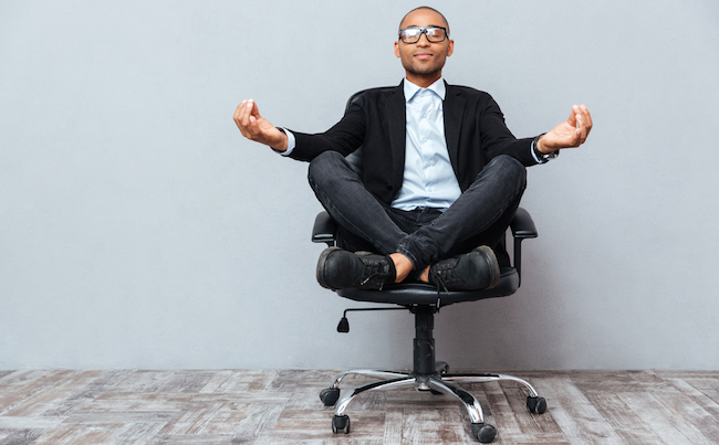 Relaxed,Handsome,African,Young,Man,Sitting,And,Meditating,On,Office