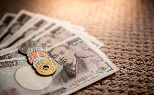 Japanese Yen Banknotes and Japanese Yen coin shot stack layers on floor. japanese currency. financial and economy money concept.