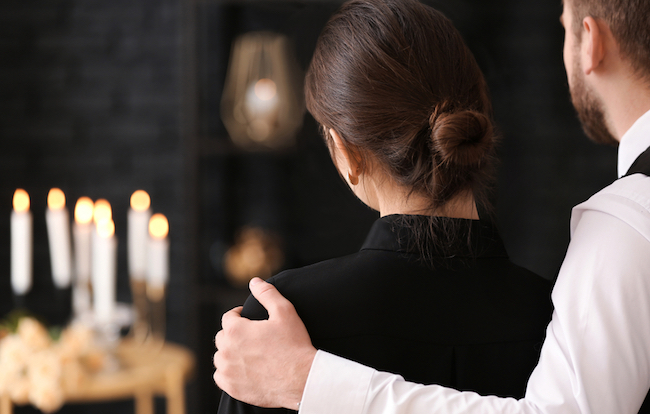 Couple,Pining,After,Their,Relative,At,Funeral