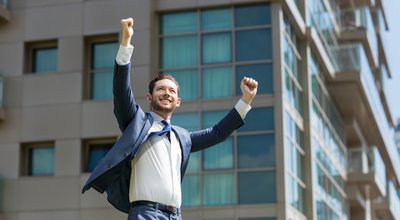 Cheerful Business Man Celebrating Success Outdoors