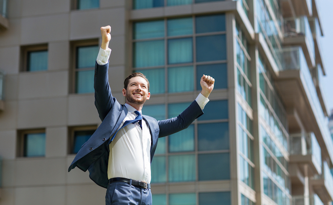 Cheerful Business Man Celebrating Success Outdoors