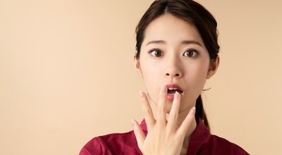 Surprised young asian woman. Shocked girl.