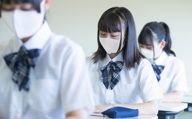 High,School,Girl,Studying,With,A,Mask