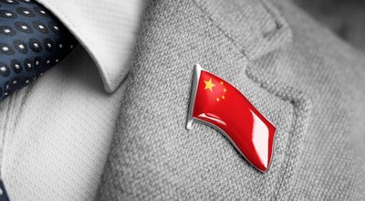 Metal badge with the flag of China on a suit lapel