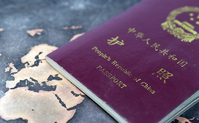 Chinese passport and world map