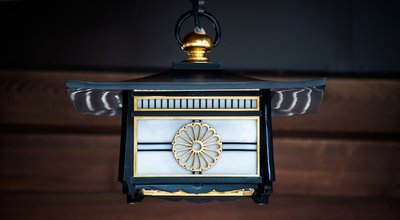Japanese lantern showing the Chrysanthemum design of the Imperial Seal of Japan at the Meiji Shrine, Tokyo