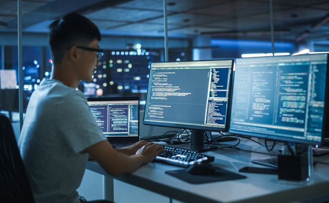 Night,Office:,Young,Japanese,Man,In,Working,On,Desktop,Computer.