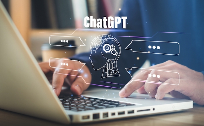 ChatGPT Chat with AI or Artificial Intelligence.  Young businessman chatting with a smart AI or artificial intelligence using an artificial intelligence chatbot developed by OpenAI.