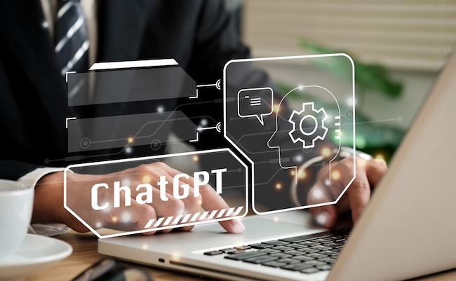ChatGPT Chat with AI or Artificial Intelligence. Young businessman chatting with a smart AI or artificial intelligence using an artificial intelligence chatbot developed by OpenAI.