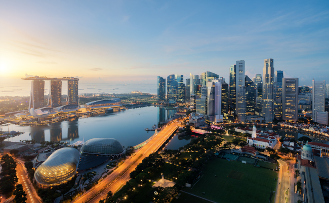 Aerial,View,Of,Singapore,Business,District,And,City,At,Twilight