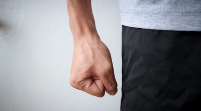 Flea angry man wearing a gray shirt and black pants emotionally angry anger of asian people and blood vessels at hand and white background texture objects