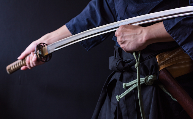 Portrait of samurai holding japanese sword
