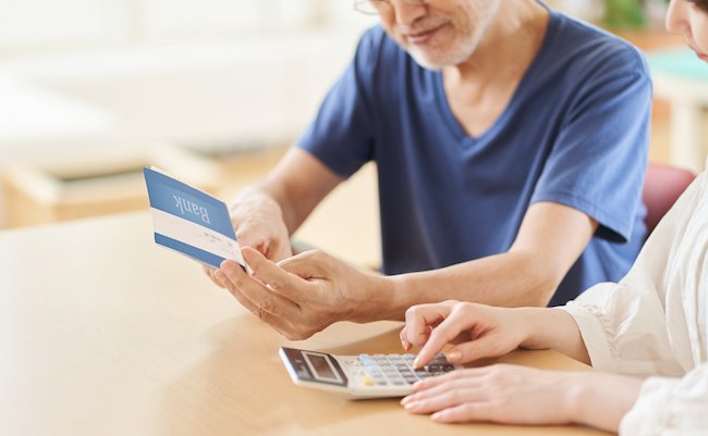 Parent and child looking at the passbook