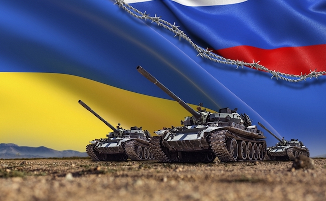 A Group of tanks lined up in front of Russian and Ukrainian flags. Several military army war battle tank vehicles on the terrain are ready to attack. Russian-Ukrainian conflict or war