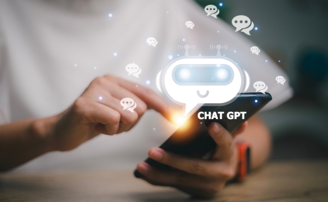 ChatGPT Chat with AI or Artificial Intelligence. woman chatting with a smart AI or artificial intelligence using an artificial intelligence chatbot developed by OpenAI.