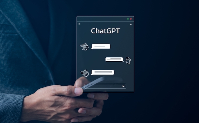 ChatGPT Chat with AI or Artificial Intelligence technology. businessman using smartphone chatting with intelligent artificial intelligence. Developed by OpenAI. Futuristic technology. automate chatbot