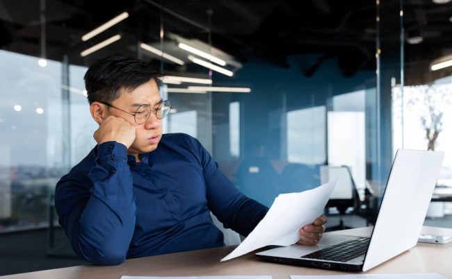 Tired,Young,Asian,Man,,Accountant,,Businessman,,Freelancer.,He,Sits,In