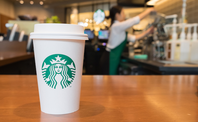 OSAKA, JAPAN JUL 09 2016: A tall Starbucks coffee in starbucks offee shop. Starbucks is the world's largest coffee house with over 20,000 stores in 61 countries.