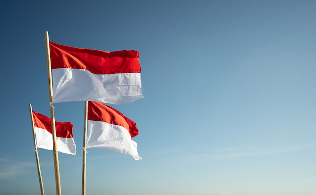 Indonesia,Flags,Under,Blue,Sky,Independence,Day,Concept