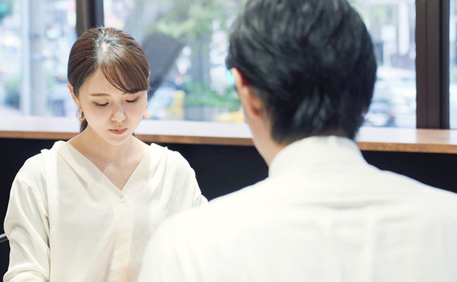 Woman,And,Man,Facing,Each,Other.