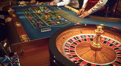 People,Gambling,At,Roulette,Poker,In,A,Casino.