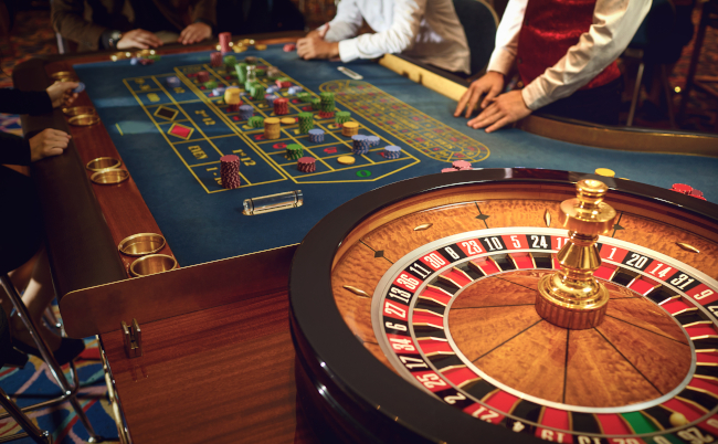 People,Gambling,At,Roulette,Poker,In,A,Casino.