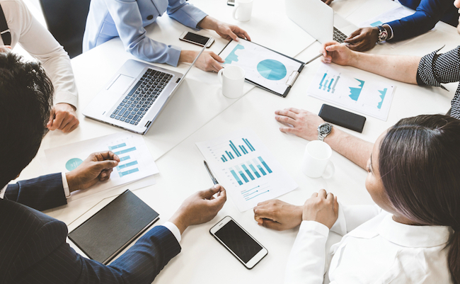 Documents,,Gadgets,And,Hands,Of,People,On,The,Desktop,,Top