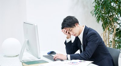 Asian office worker being tired