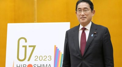 Japanese,Prime,Minister,Fumio,Kishida,Stands,With,The,Logo,For