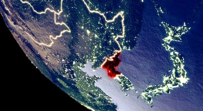 Orbit view of North Korea at night with bright city lights. Very detailed plastic planet surface. 3D illustration. Elements of this image furnished by NASA.