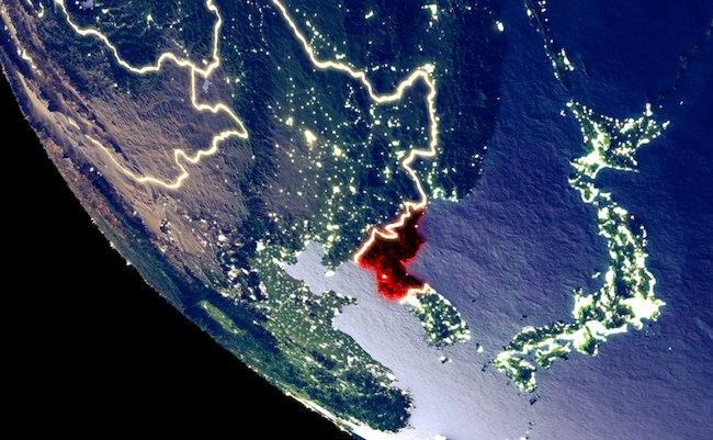 Orbit view of North Korea at night with bright city lights. Very detailed plastic planet surface. 3D illustration. Elements of this image furnished by NASA.
