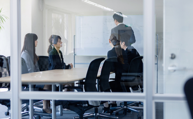 Group of businessperson meeting in office.
