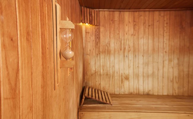 Empty sauna with hourglass in a spa hotel for wellness and relaxation