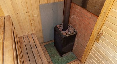 Interior details of traditional Finnish sauna steam room. Traditional old Russian bathhouse SPA Concept. Relax country village bath concept