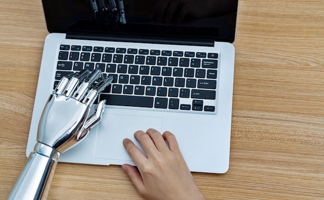Robot,Hand,And,Human,Hand,Using,Laptop.