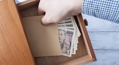 Secret stash in the drawer.Japanese 10,000 yen bill.