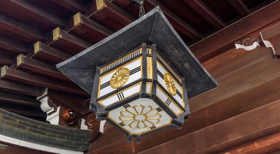 TOKYO, JAPAN - DEC 01, 2014: Ancient style Japanese lamp at Meiji Jingu Shrine, Tokyo, Japan. It is the Shinto shrine that is dedicated to the deified spirits of Emperor Meiji and his wife.