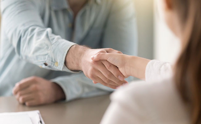 Businessman,Shaking,Female,Hand,Above,The,Table.,Business,Agreement,And