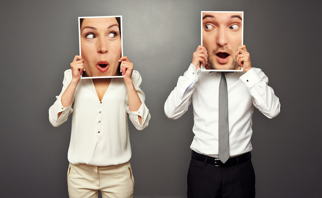 Man,And,Woman,Holding,Surprised,Faces.,Concept,Photo,Over,Grey