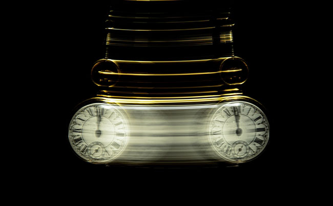 Gold,Pocket,Watch,Swinging,Hypnotically,From,Chain.,Black,Background