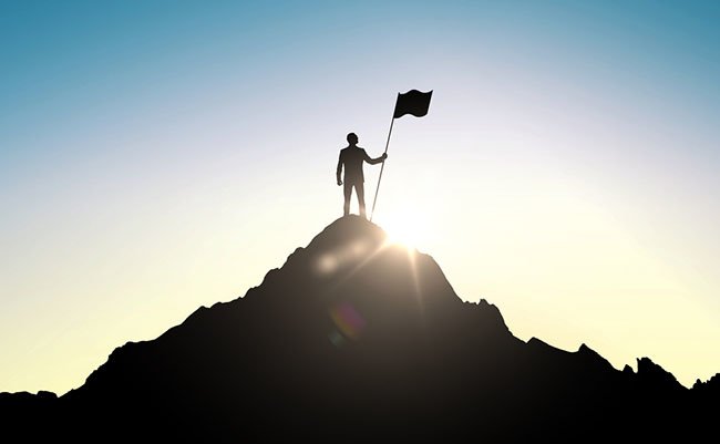 business, success, leadership, achievement and people concept - silhouette of businessman with flag on mountain top over sky and sun light background