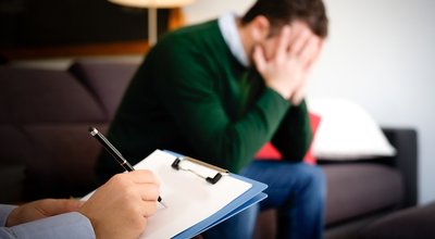 Man with mental health problem in the psychiatrist studio