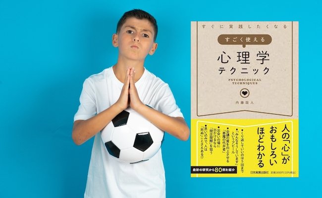 Positive Little hispanic boy wearing white T-shirt smiles happily, glad to receive pleasant news from interlocutor, keeps palms together, People emotions concept.