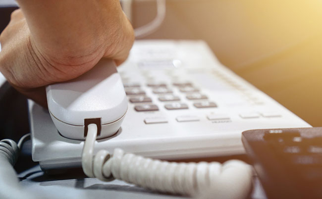 The,Office,Worker,Is,Hanging,Up,The,Phone.