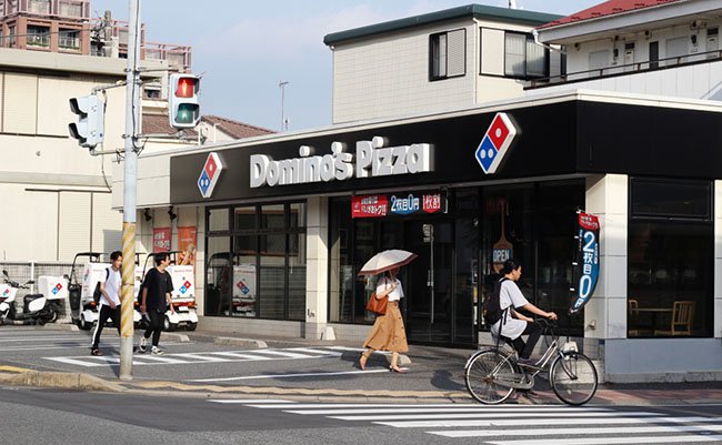 CHIBA, JAPAN - July 13, 2018: View of the front of a Domino's Pizza restaurant in Chiba City.