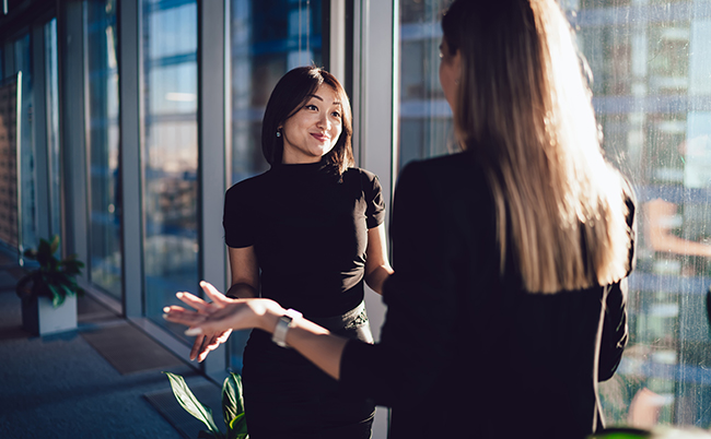 Young,Female,Managers,In,Elegant,Wear,Discussing,Working,Issues,Gesturing