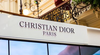 MOSCOW, RUSSIA - AUGUST 10, 2021: Christian Dior Paris brand retail shop logo signboard on the storefront in the shopping mall