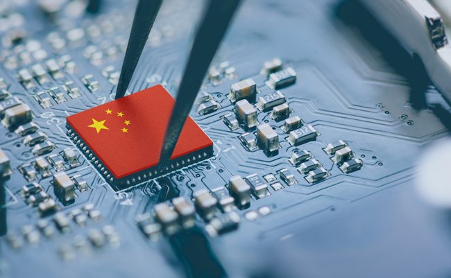 Flag of China on a processor, CPU Central processing Unit or GPU microchip on a motherboard. China is world's largest chip manufacturer, demonstrating the country's superiority in global supply chain.