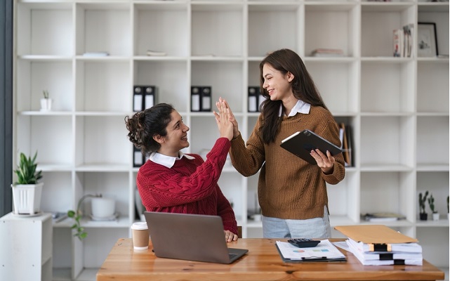 Successful,Business,People,Giving,Each,Other,A,High,Five,In